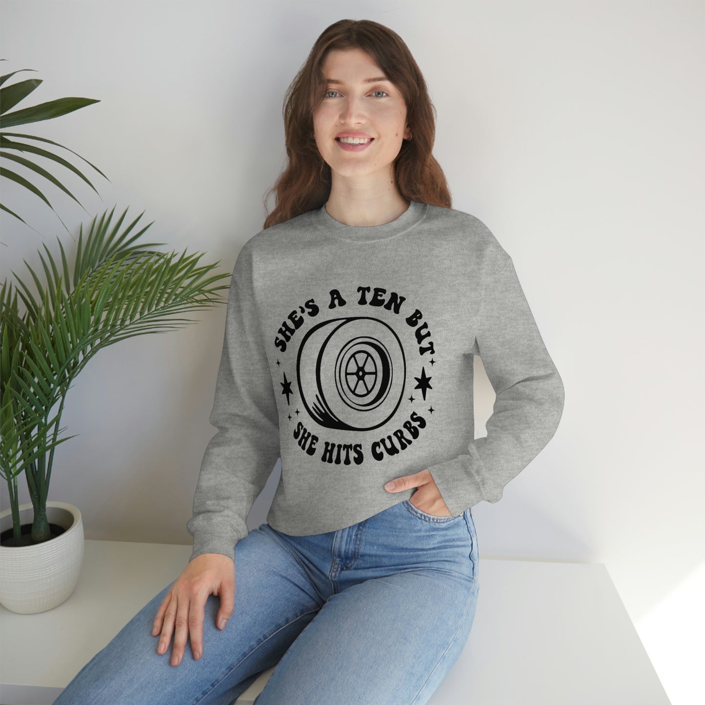 "She's a ten, but she hits curbs" Unisex Heavy Blend™ Crewneck Sweatshirt